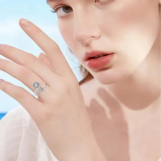 Rotating moonstone ring with adjustable opening, white gold electroplated finish, geometric circle and triangle design