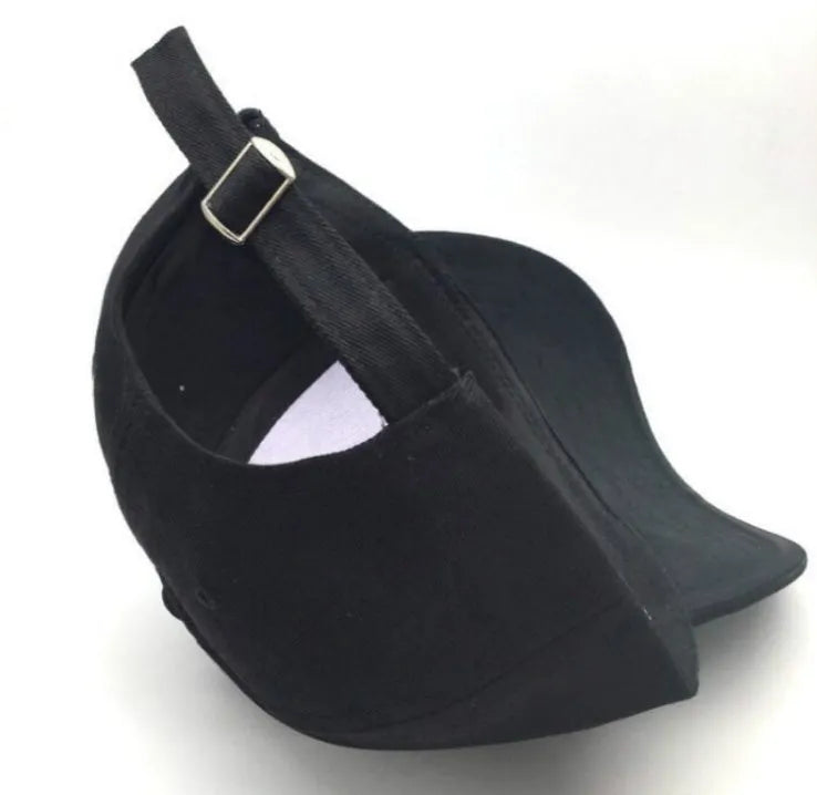 Letter embroidered cotton baseball cap in black with curved brim on white background