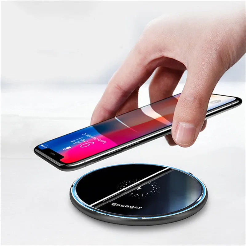 Black aluminium alloy 15W Qi wireless charging pad on a table with LED light.