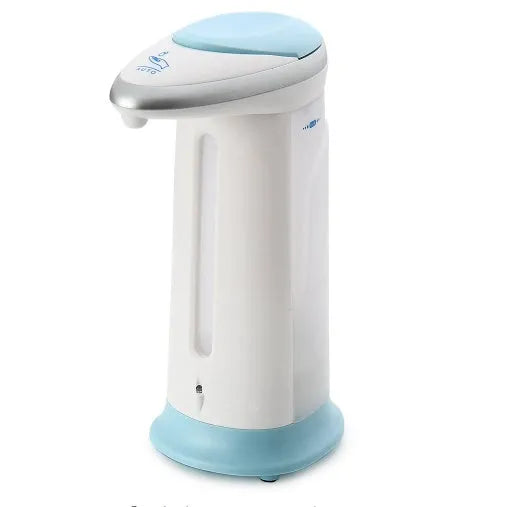 Automatic sensor soap dispenser on a desktop, white ABS plastic body with infrared sensor.