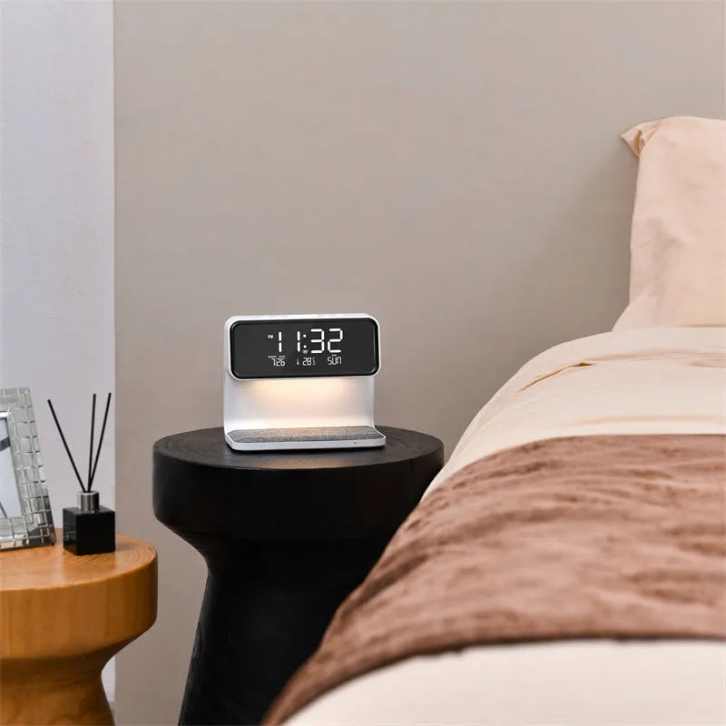 White bedside lamp with wireless charging pad and LCD clock display on base