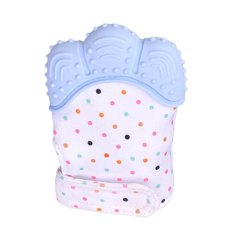 BPA-free silicone baby teether glove fastened with a white Velcro strap on a baby's hand