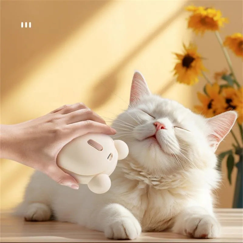 Pink rechargeable pet grooming brush with spray nozzle and removable silicone comb teeth