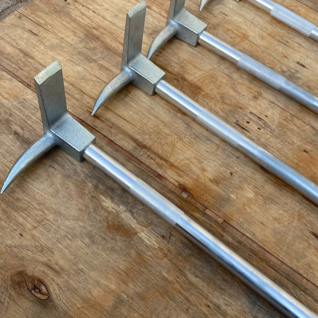 Silver carbon steel wrecking bar 24 inches 61cm multifunctional fire breaking tool on plain background