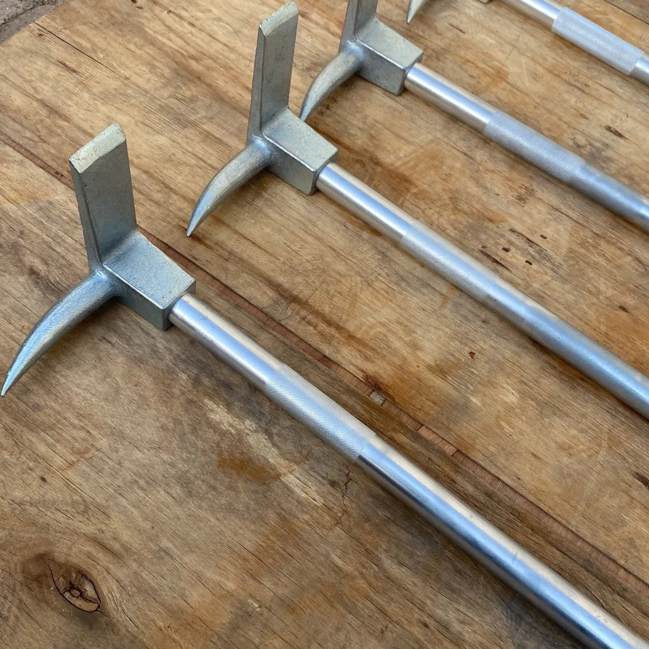 Silver carbon steel wrecking bar 24 inches 61cm multifunctional fire breaking tool on plain background