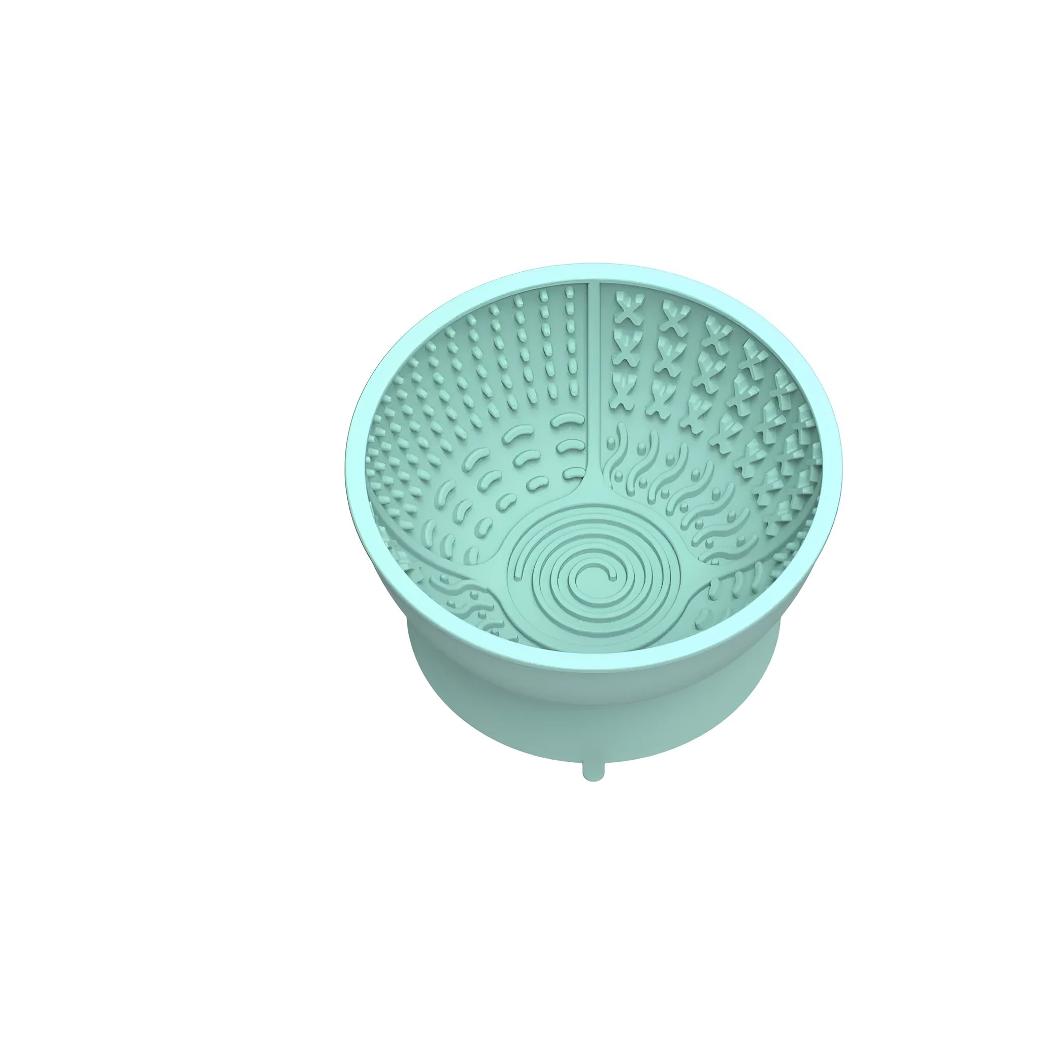 Cyan silicone dog bowl with textured slow-feed surface and a suction cup base on a kitchen floor.