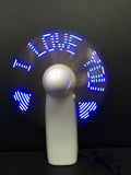 White handheld mini fan showing blue LED 'I Love You' pattern, dimensions 10.8cm.