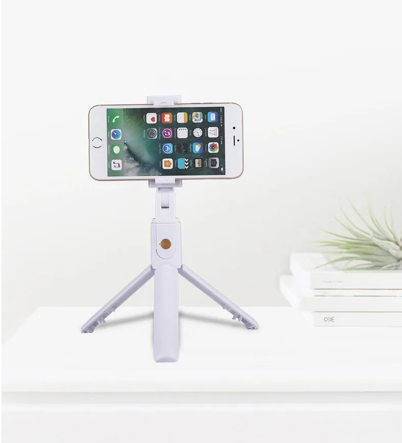 Bluetooth selfie stick tripod folded and extended on white background, black colour, plastic construction