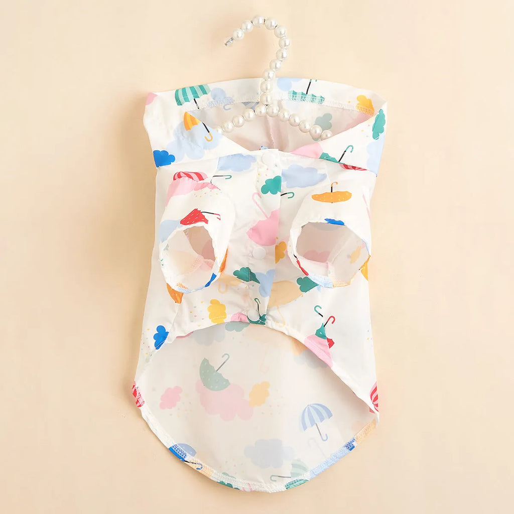 Colourful cartoon umbrella pattern dog raincoat in size M on a mannequin.