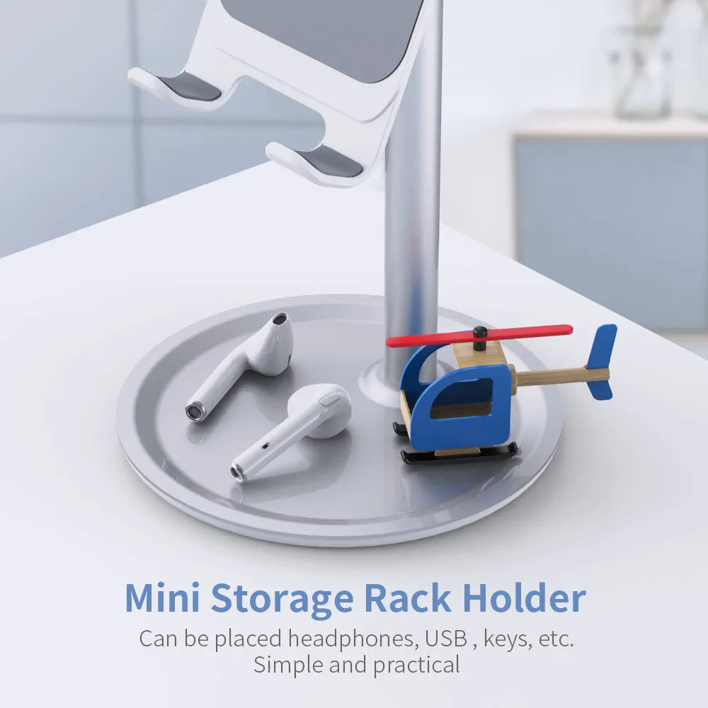 Silver white aluminium alloy desktop stand holding a mobile phone.