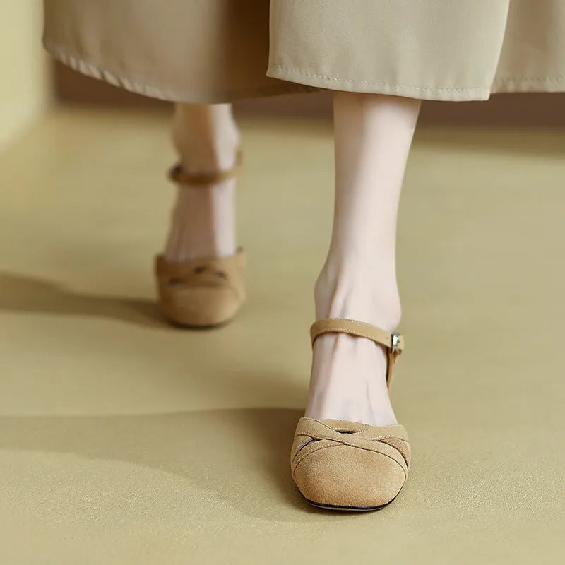 Apricot and green Roman sandals with round toe and buckle fastening.