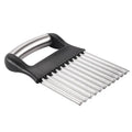Stainless steel potato wave knife with crinkle-cut blade on a wooden cutting board.