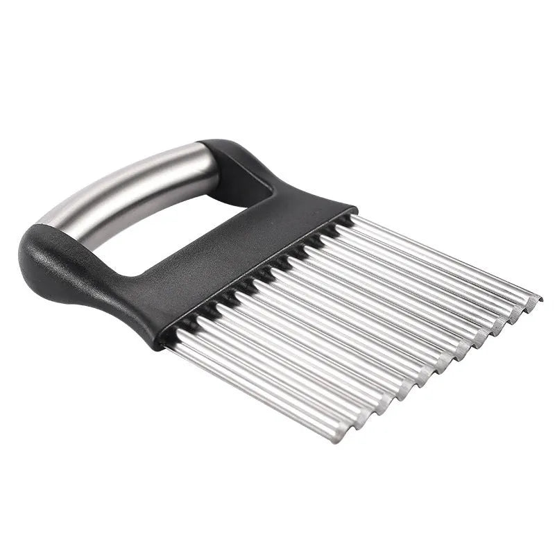Stainless steel potato wave knife with crinkle-cut blade on a wooden cutting board.