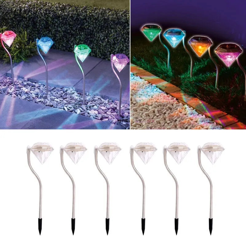 Solar-powered diamond-shaped garden light with solar panel on adjustable stake.