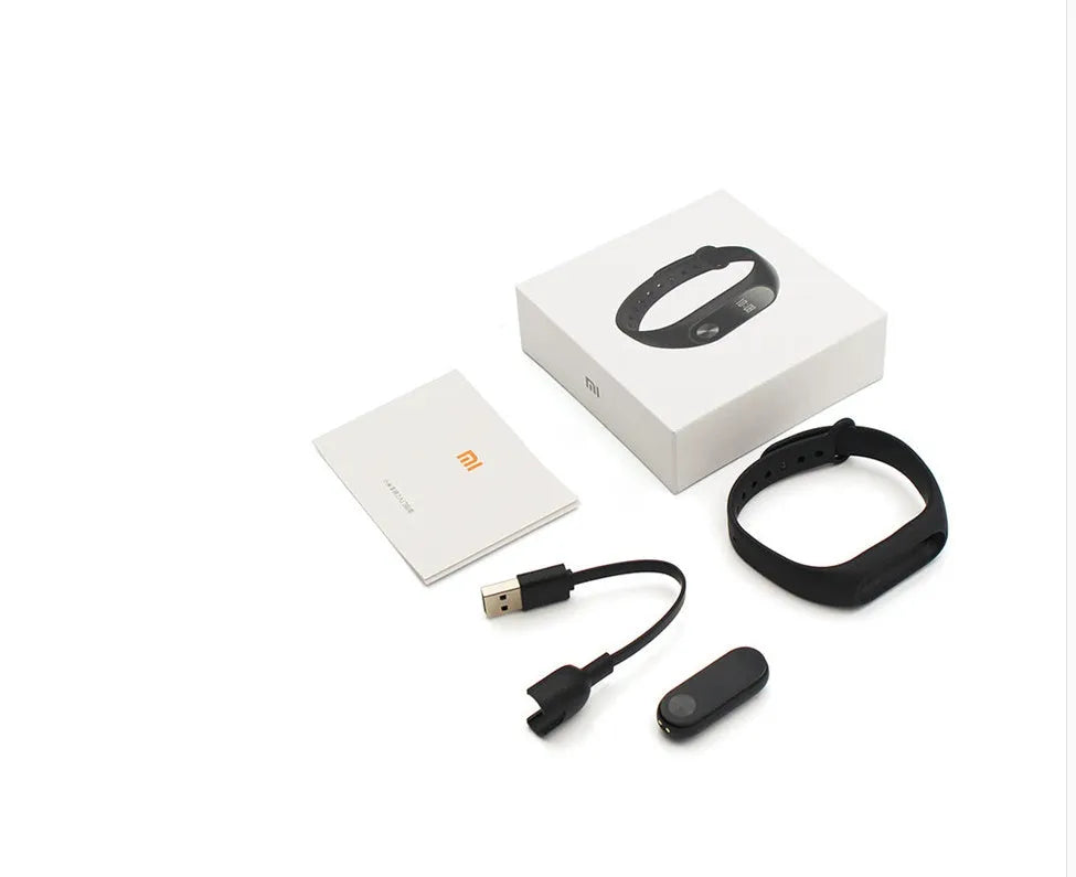 Black Xiaomi Mi Band 2 smartband with OLED display on a thermoplastic wrist strap.