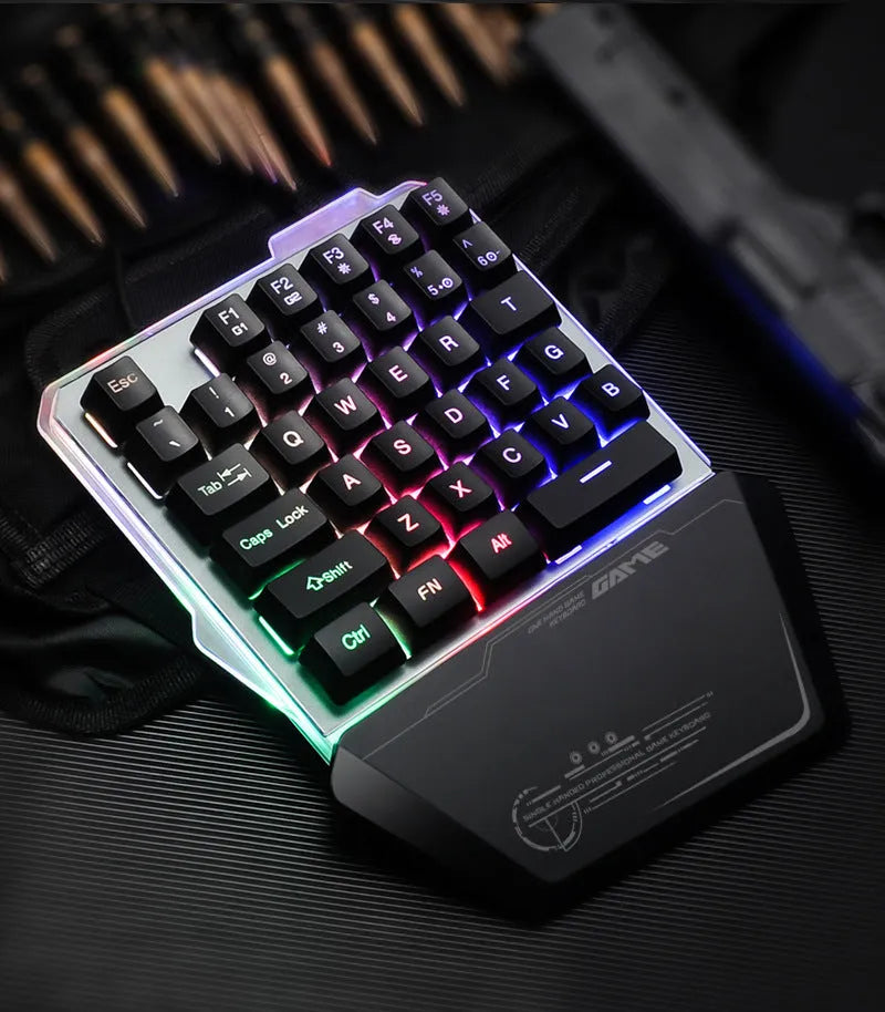 Black Robotic G40 Flow one-handed mechanical keyboard with RGB backlit keys on a desk.