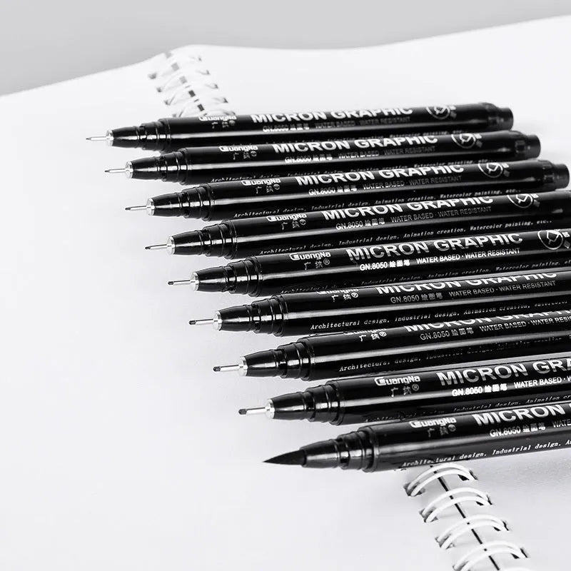 Set of 12 black comic drawing pens with assorted microtip nibs in a fabric organiser pouch.