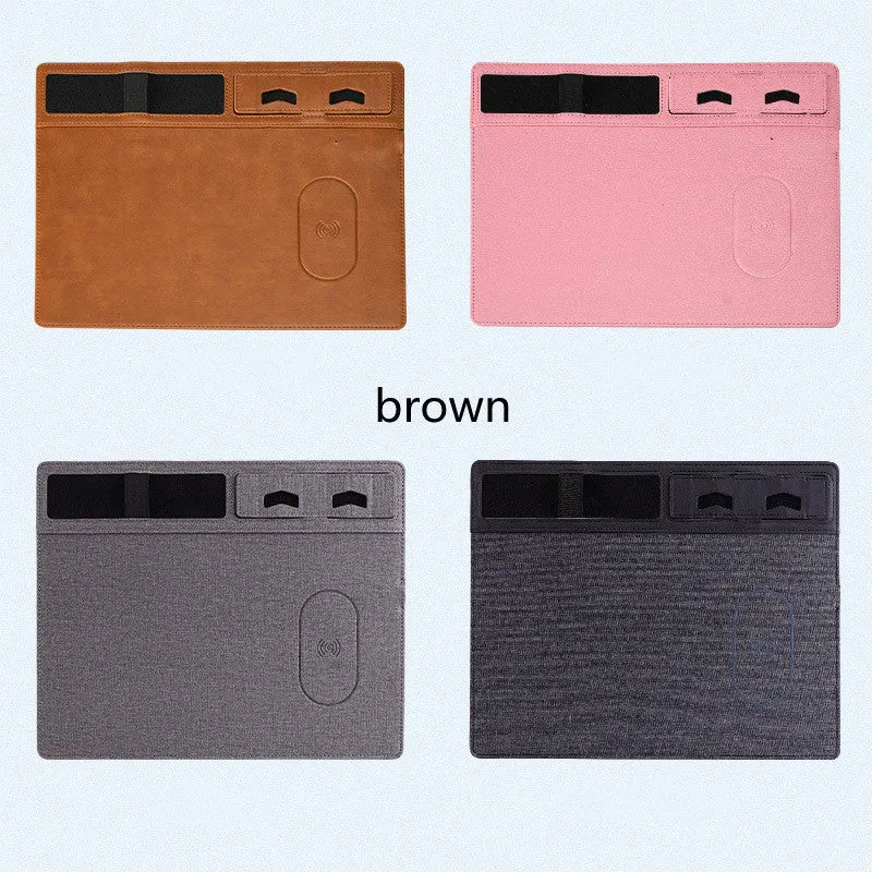 Pink PU leather mouse pad with wireless charging spot and an upright phone in the holder