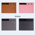 Pink PU leather mouse pad with wireless charging spot and an upright phone in the holder