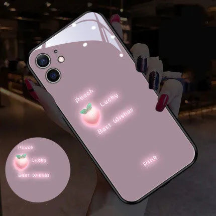 Luminous purple and white daisy iPhone case with voice-activated colour lights on a phone.