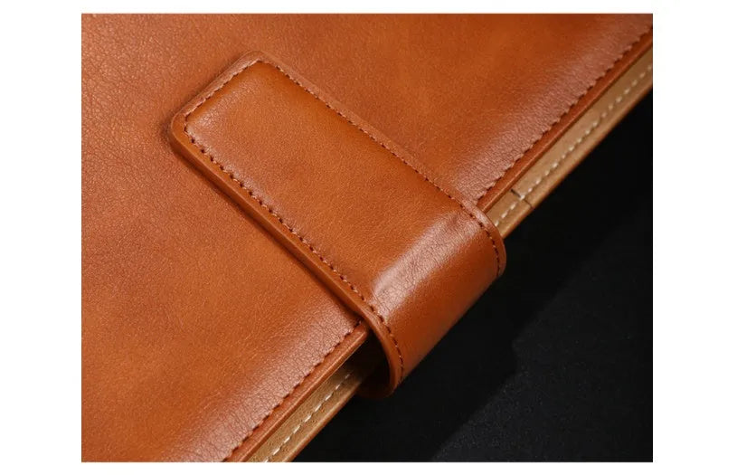 Hardcover A5 leather notebook with buckle closure in five colour options showing interior Daolin paper