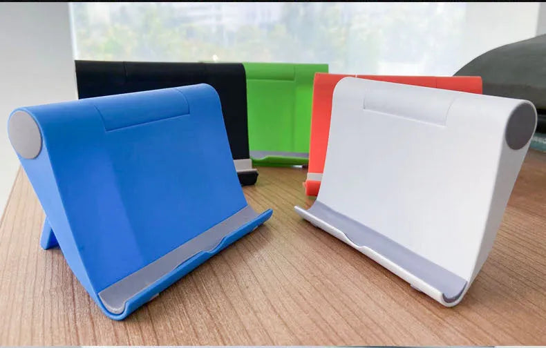 Black folding PE plastic mobile phone and tablet stand holding a smartphone at an angle.