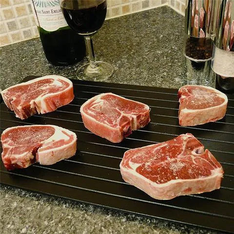 Black aluminium defrosting tray for thawing frozen meat without microwave