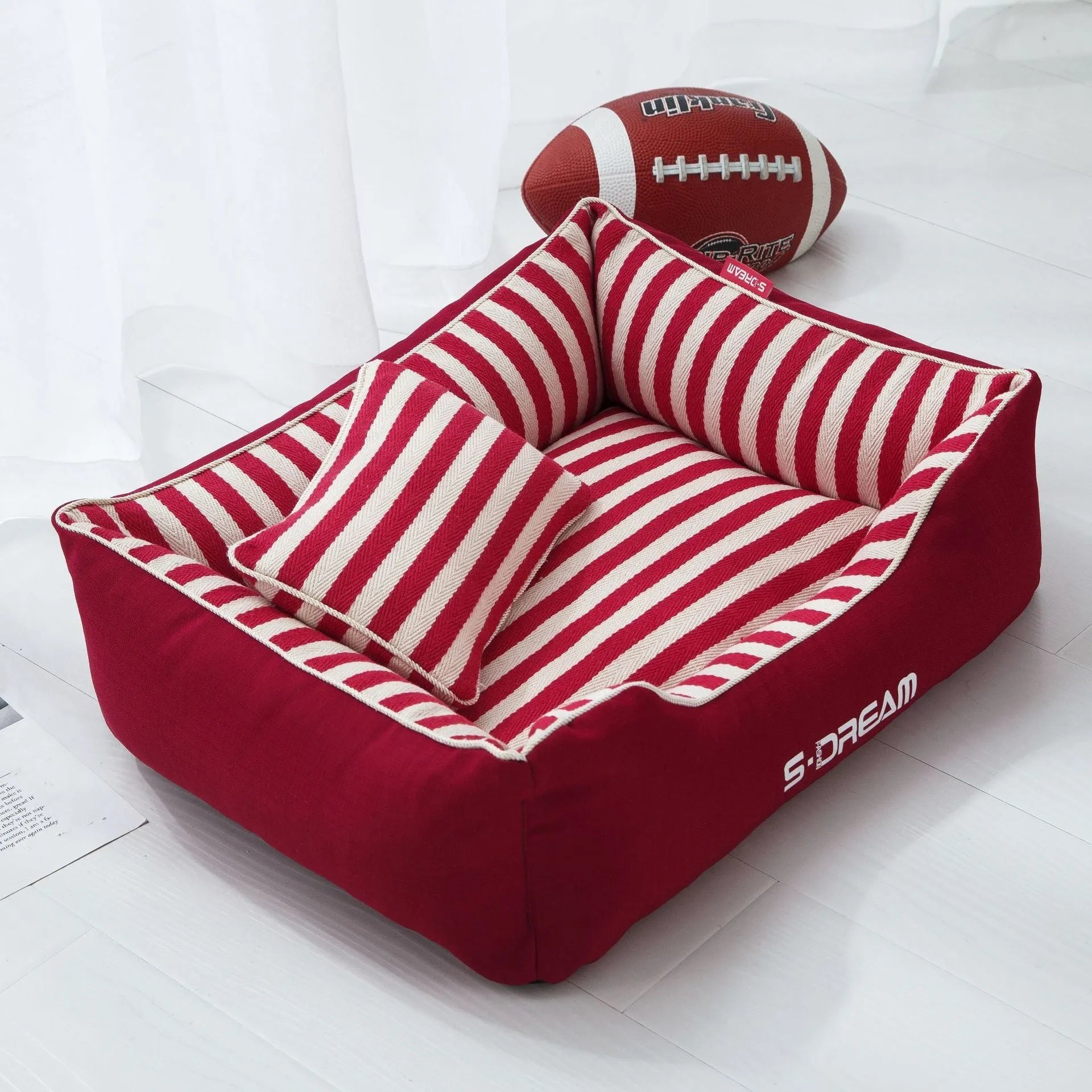 Navy stripes washable dog kennel mat with removable cover and a blue mini pillow, shown in an L size.