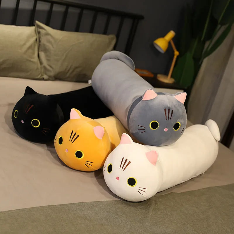 Large grey cat plush toy pillow on a sofa showing its soft texture and size.
