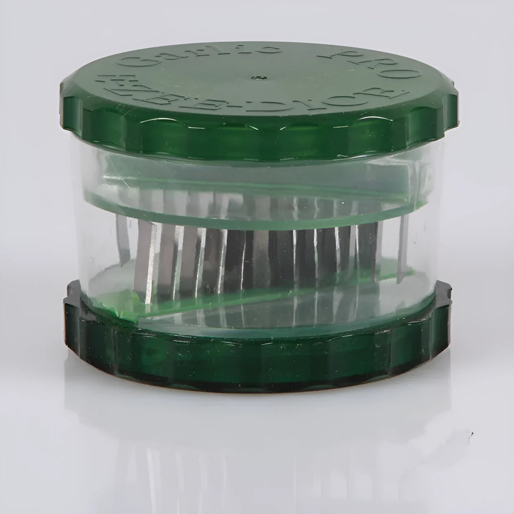 Green transparent plastic garlic peeler kitchen gadget on a counter.