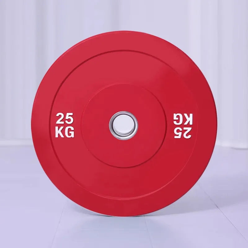 Macaron elastic rubber weight plate in blue 20kg with large centre hole on a gym floor