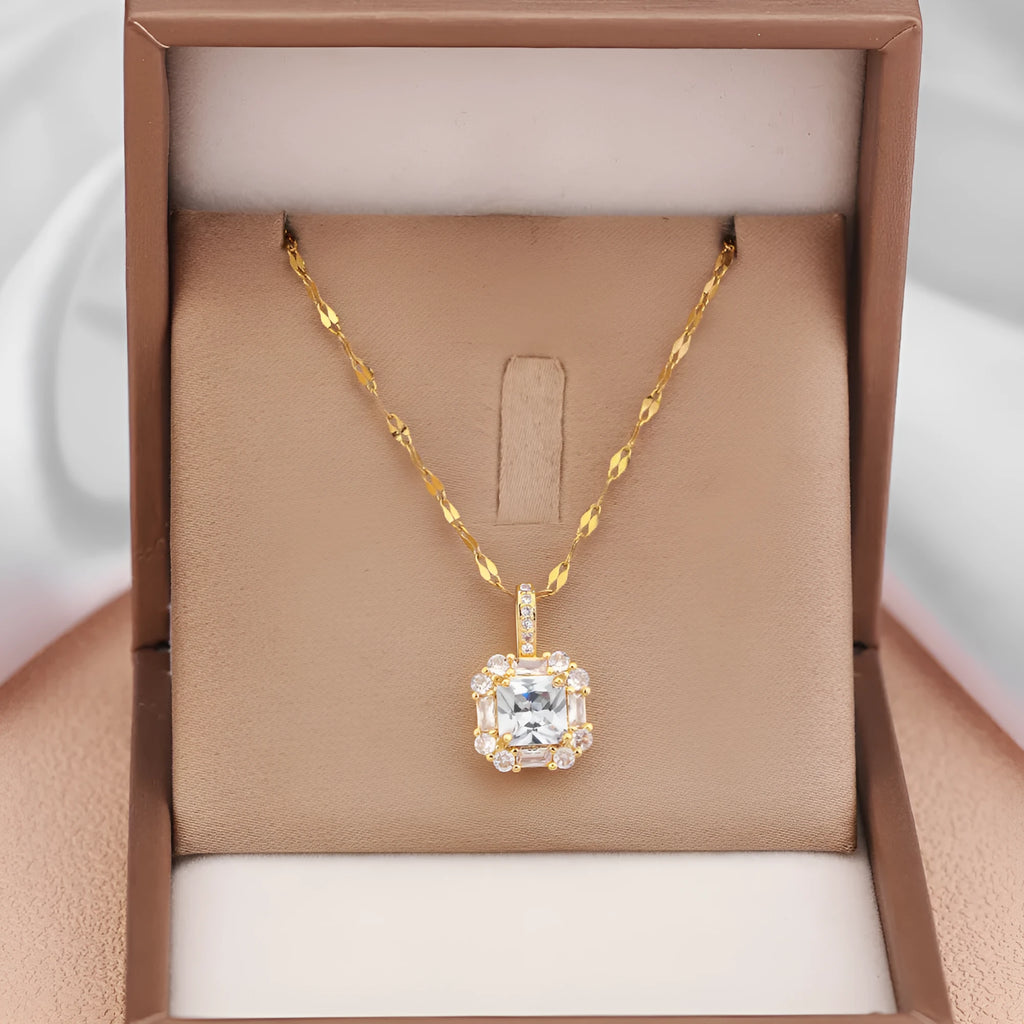 Geometric quadrilateral pendant necklace with mixed gem inlay on a gold titanium steel chain.