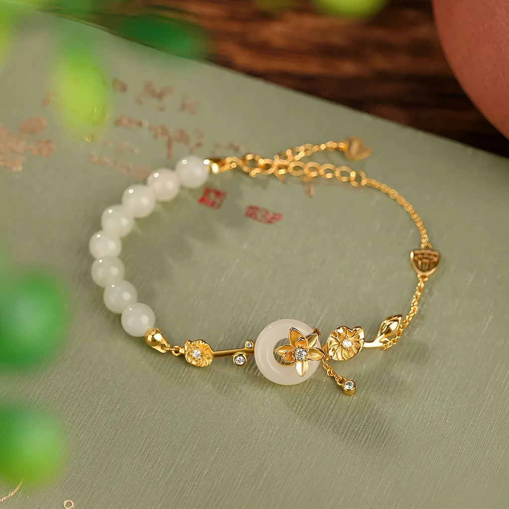 Women's retro bracelet with Hetian jade lotus peace buckle design in 925 silver