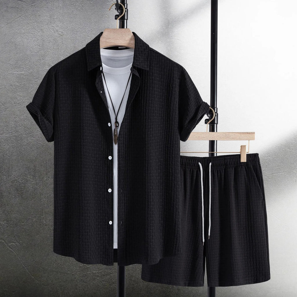 Men's white cotton blend beach shorts suit with short sleeve shirt on a hanger.