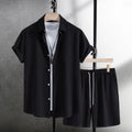 Men's white cotton blend beach shorts suit with short sleeve shirt on a hanger.