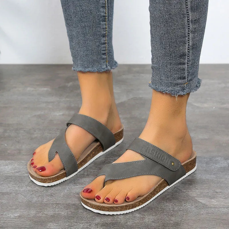 Flat toe ring flip-flops with a thick foam sole in a solid blue colour on a white background.