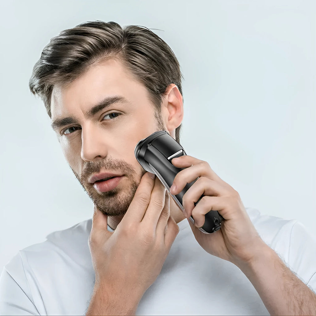 Men's electric shaver with three rotating heads, pop-up sideburn trimmer, USB cable, cleaning brush and velvet bag.