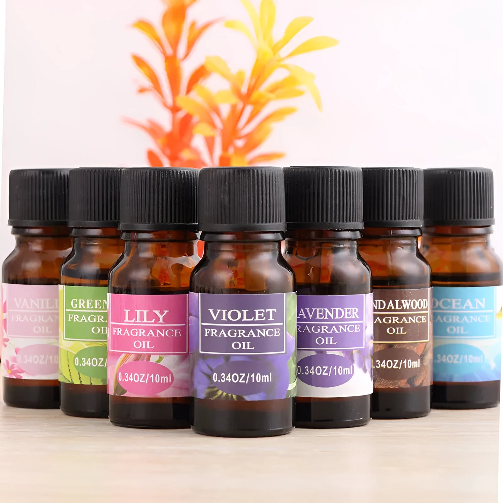 Set of 12 small glass bottles of aromatherapy essential oil, 10ml each, with labels showing Lavender, Rose, Lemon, and other fragrances.