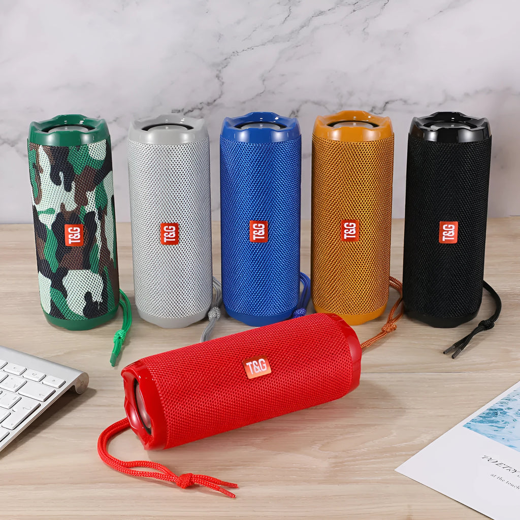 Fabric-covered portable Bluetooth speaker with integrated card holder in multiple colour options.