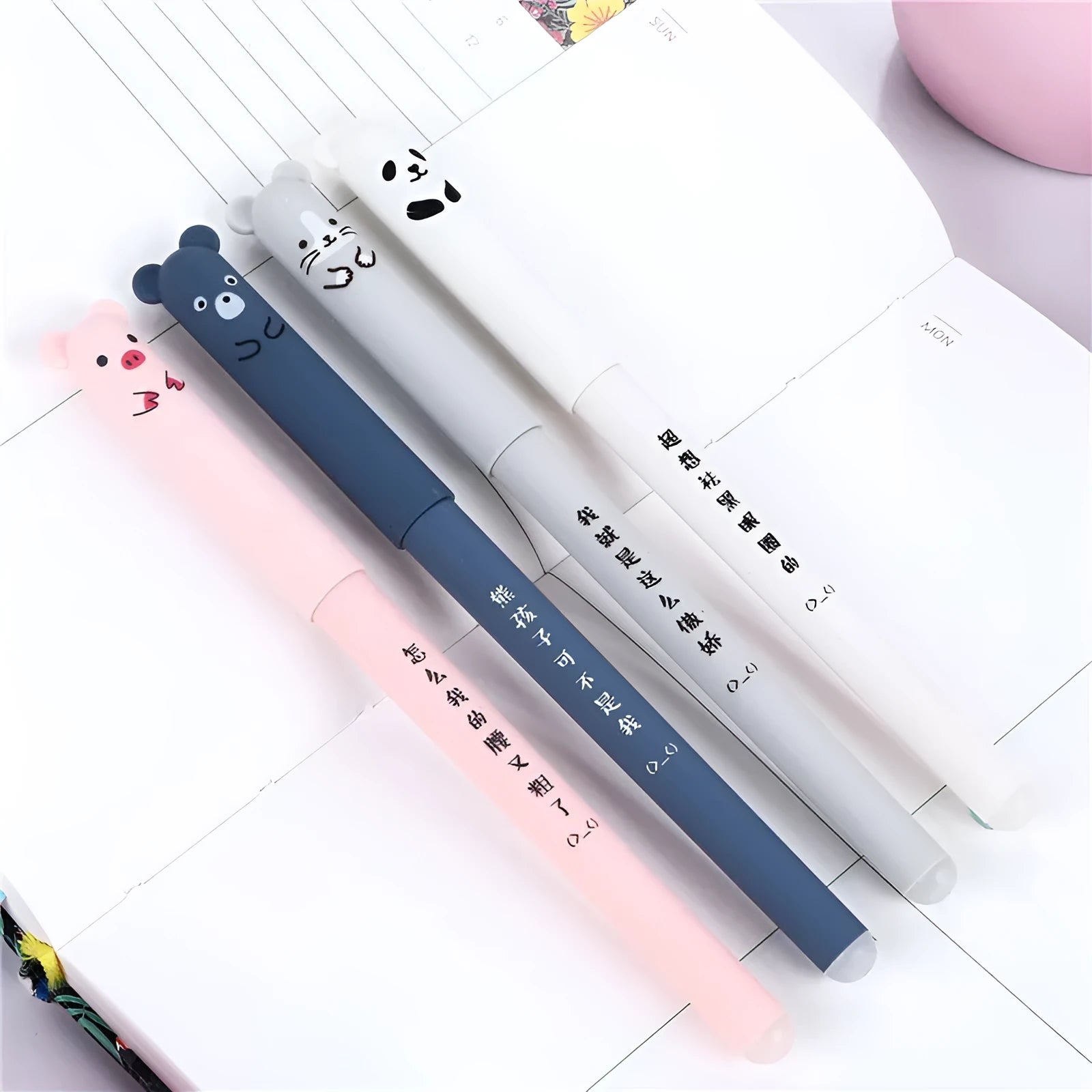 Black erasable gel pen with 0.5mm tip showing refill components including nibs and ink refills