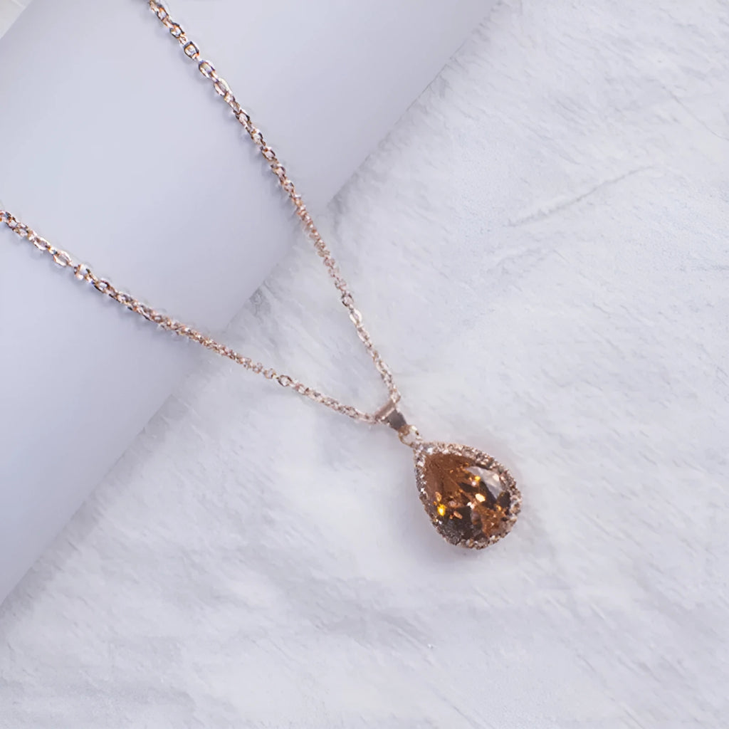 Women's rose gold rhinestone water drop necklace in pink colour with geometric design