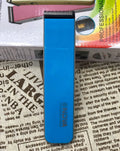 Black electric hair clipper with removable blade head on a white background.
