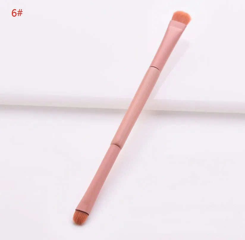 10-piece wooden handle makeup brush set including powder, foundation, eyeshadow, concealer, and lip brushes on pink background