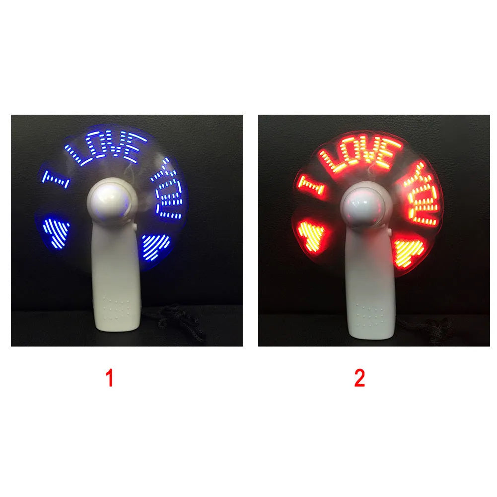 White handheld mini fan showing blue LED 'I Love You' pattern, dimensions 10.8cm.