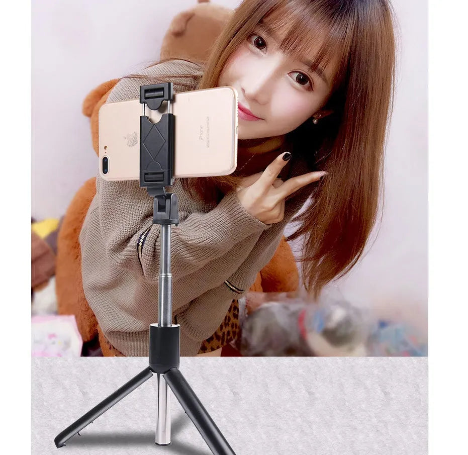 Bluetooth selfie stick tripod folded and extended on white background, black colour, plastic construction