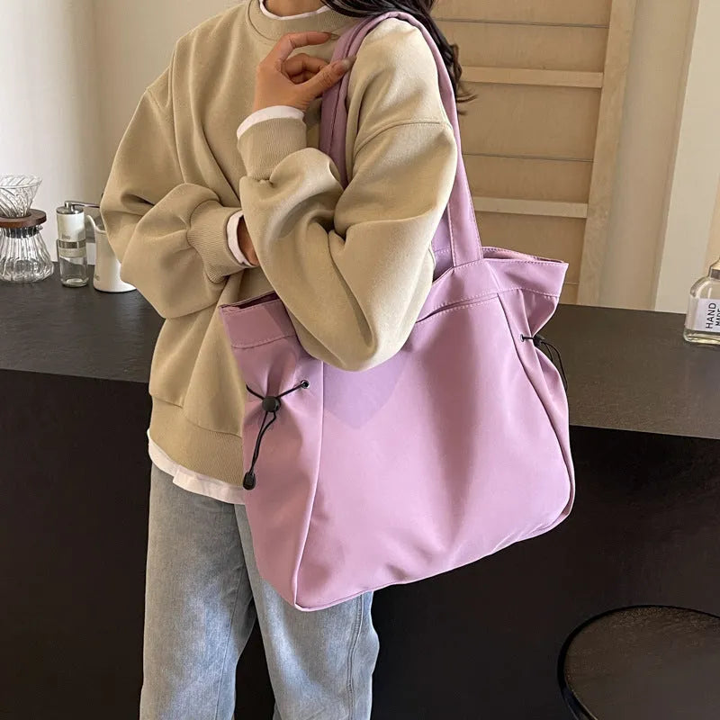 Foldable Oxford cloth commuter tote bag in street trend style, shown in multiple colour options.