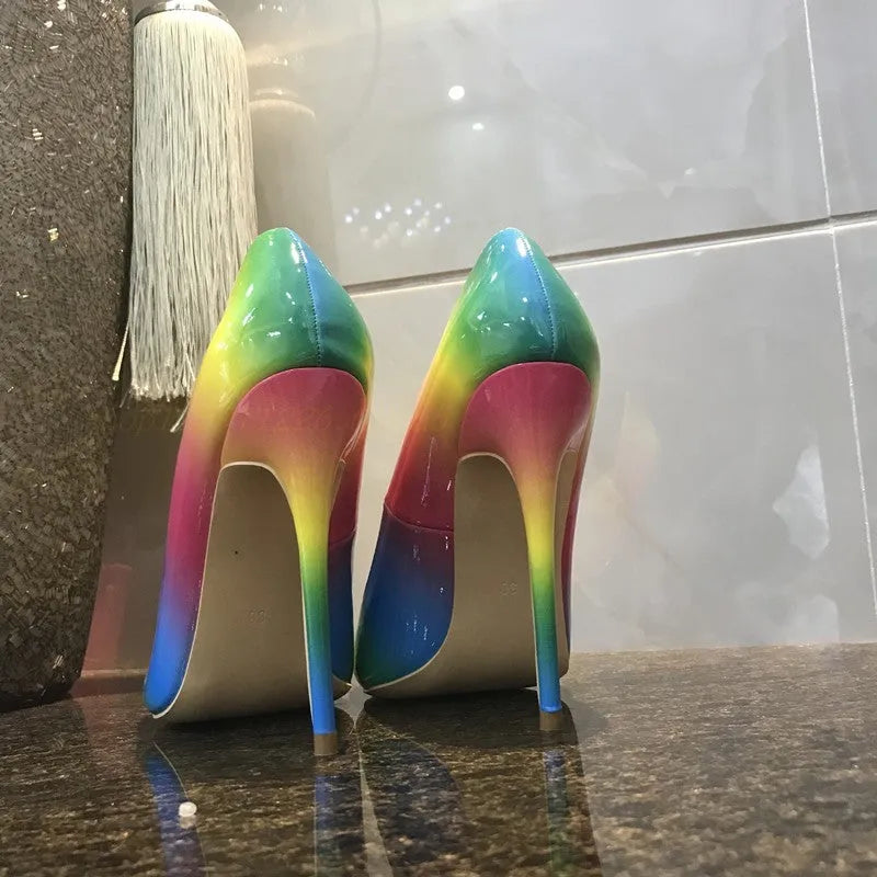 Rainbow patent leather women's high heel shoes with pointed toe and thin stiletto heel.