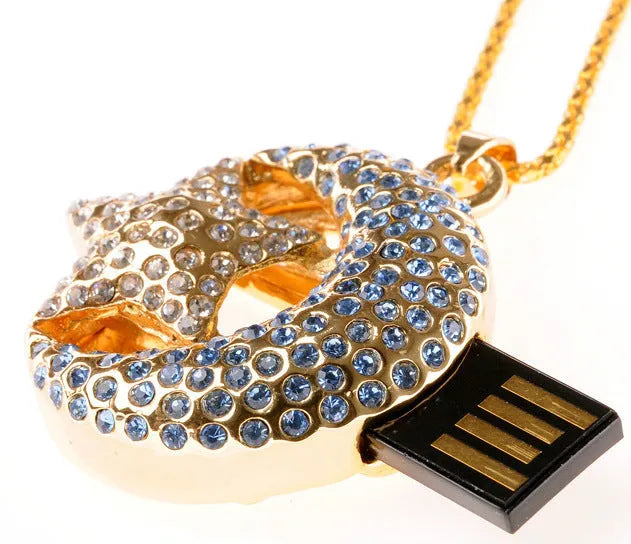 Silver Jewelry Xingyue metal USB flash drive on a keyring against a plain background.