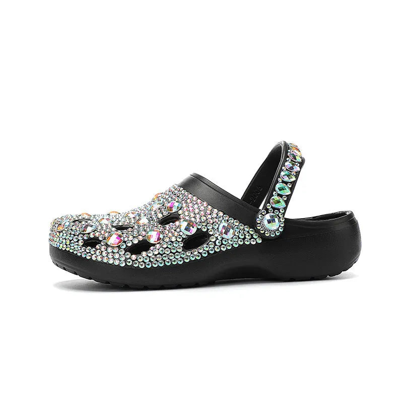 Black women's platform sandals with rhinestone detail on an EVA upper and a textured injection-moulded sole.