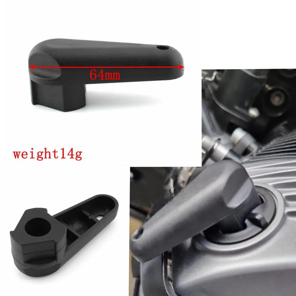 Black nylon quick release wrench for BMW motorcycle engine oil cap on a plain background